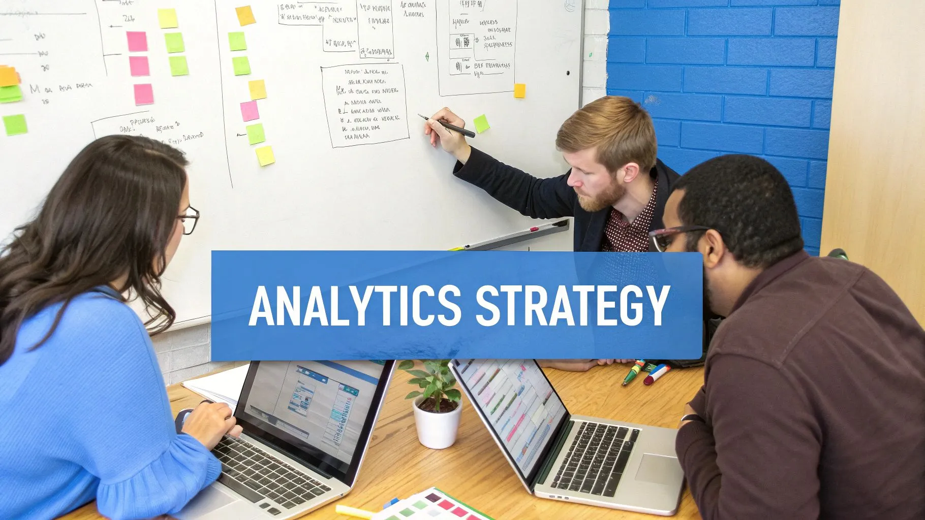 A team of professionals collaborating around a screen showing data visualizations